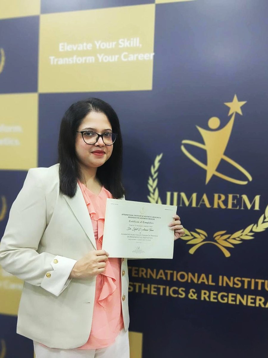 Dr. Sifat-E-Aman holding her certificate of completion for Advanced Injectables Hands-On Training on Regenerative Aesthetics, IIMAREM.