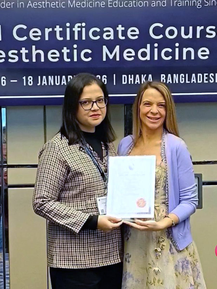Dr. Sifat-E-Aman receiving her certificate at the American Academy of Aesthetic Medicine Certificate Course in Aesthetic Medicine, Dhaka, January 2026.
